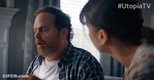 Man And Woman Standing In Front Of Window With Utopiatv GIF