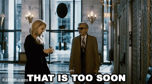 Man And Woman Standing In Hallway GIF