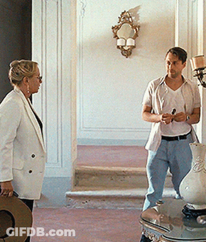 Man And Woman Standing In Hallway GIF