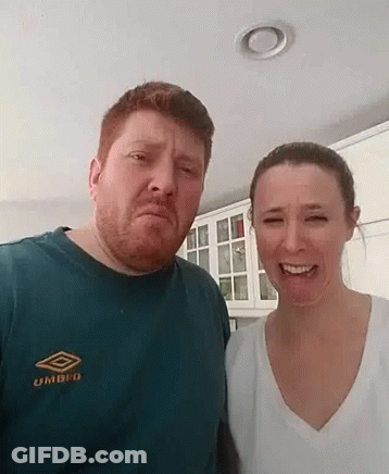 Man And Woman Standing In Kitchen GIF