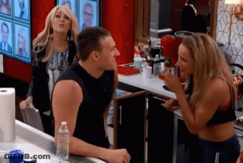 Man And Woman Standing In Kitchen With Water Bottle GIF