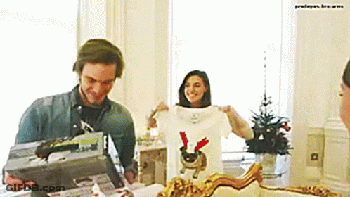 Man And Woman Standing In Living Room GIF