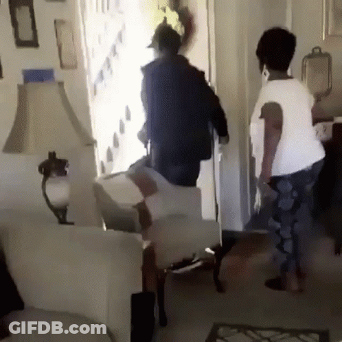 Man And Woman Standing In Living Room GIF