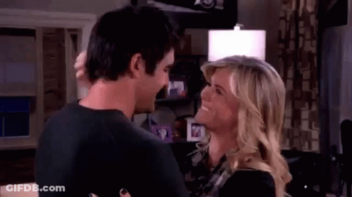 Man And Woman Standing In Living Room GIF