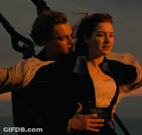 Man And Woman Standing In Ocean GIF