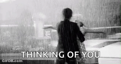 Man And Woman Standing In Rain GIF