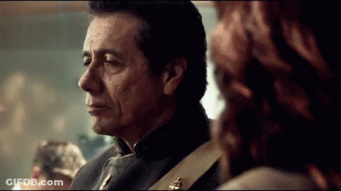 Man And Woman Standing In Room Looking At Each Other GIF