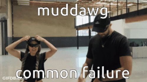 Man And Woman Standing In Room Muddawg GIF