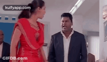 Man And Woman Standing In Room GIF