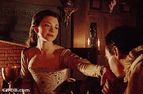 Man And Woman Standing In Room With Candles GIF