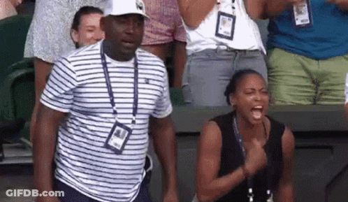 Man And Woman Standing In Stadium GIF
