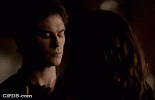 Man And Woman Standing In The Dark GIF