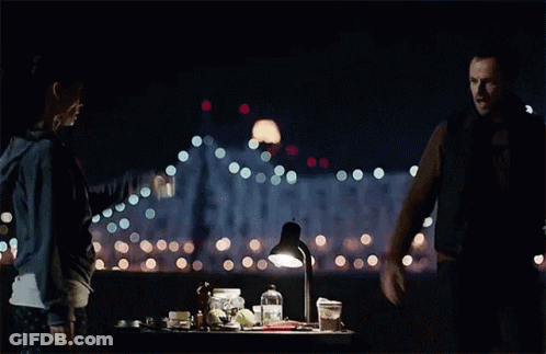 Man And Woman Standing In The Dark GIF