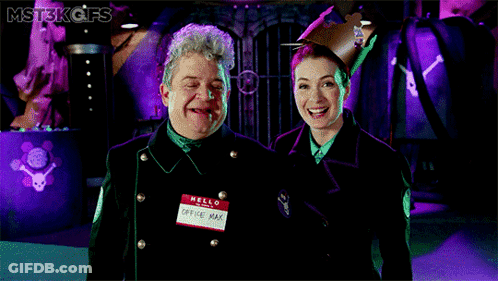 Man And Woman Standing, Man Says Hello GIF