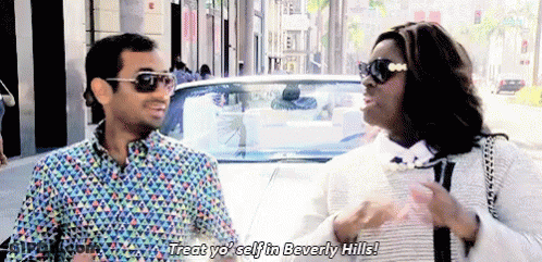 Man And Woman Standing Next To A White Car GIF