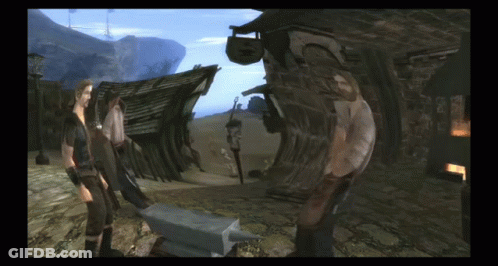 Man And Woman Standing Next To Anvil GIF