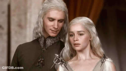 Man And Woman Standing Next To Each Other GIF