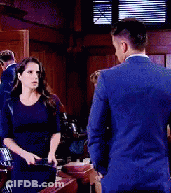 Man And Woman Standing Next To Each Other GIF