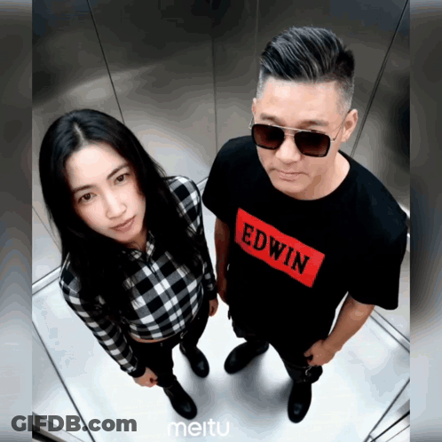 Man And Woman Standing Next To Each Other In Edwin Shirt GIF