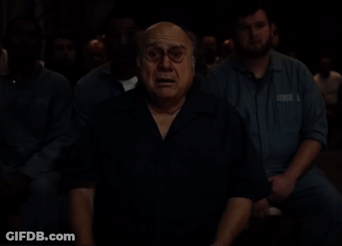 Man And Woman Standing Next To Each Other In Room GIF