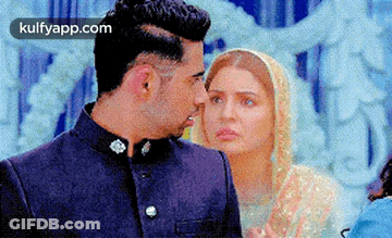 Man And Woman Standing Next To Each Other GIF