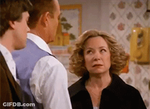 Man And Woman Standing Next To Each Other GIF