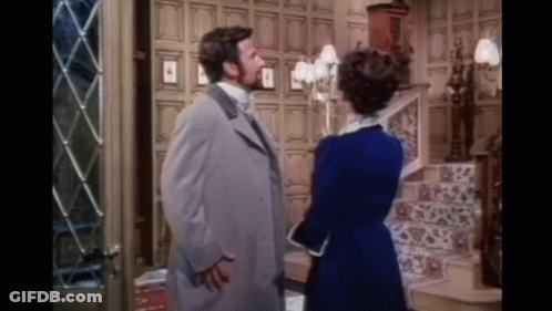 Man And Woman Standing Next To Each Other GIF