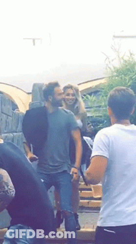 Man And Woman Standing Next To Each Other GIF