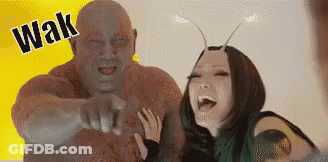 Man And Woman Standing Next To Each Other Laughing GIF