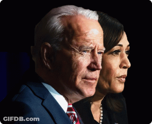 Man And Woman Standing Next To Each Other Looking At Camera GIF