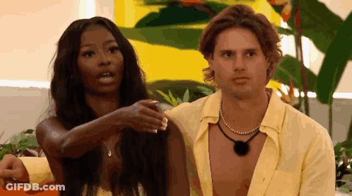 Man And Woman Standing Next To Each Other GIF