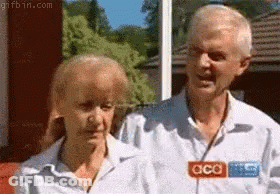Man And Woman Standing Next To Each Other GIF