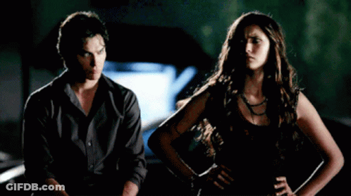 Man And Woman Standing Next To Each Other GIF