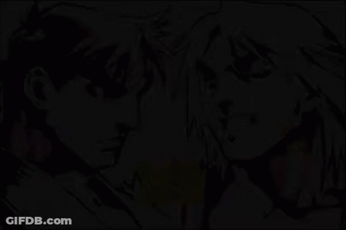 Man And Woman Standing Next To Each Other Saying Vs GIF