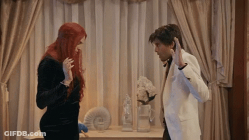 Man And Woman Standing Next To Each Other GIF