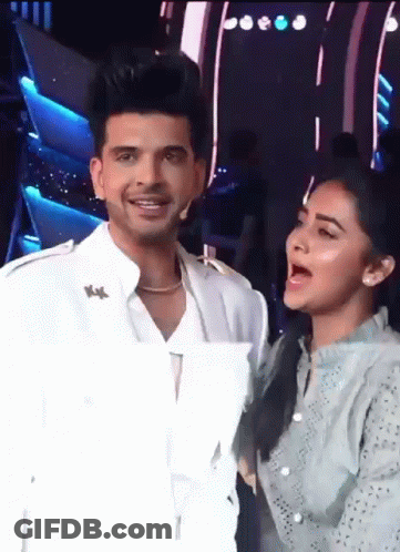 Man And Woman Standing Next To Each Other Woman Singing GIF