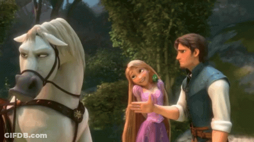 Man And Woman Standing Next To Horse GIF