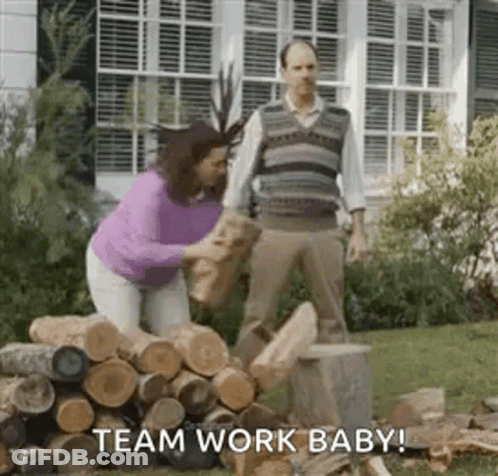 Man And Woman Standing Next To Logs GIF