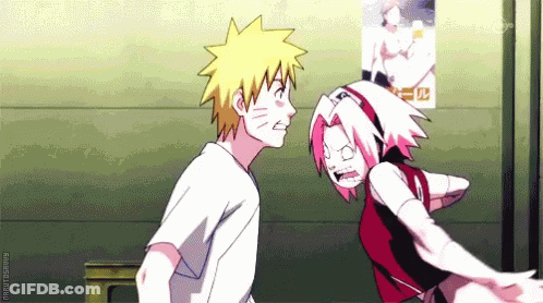 Man And Woman Standing Next To Poster GIF