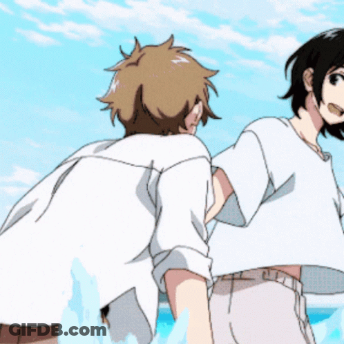 Man And Woman Standing On Beach GIF