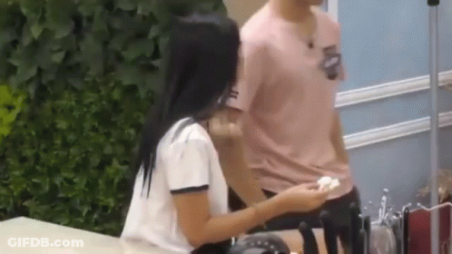 Man And Woman Standing On Sidewalk GIF