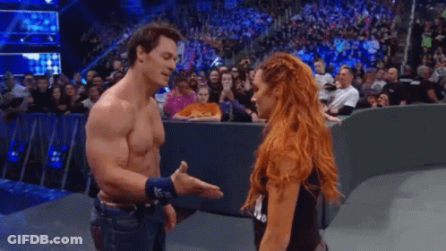 Man And Woman Standing On Stage GIF