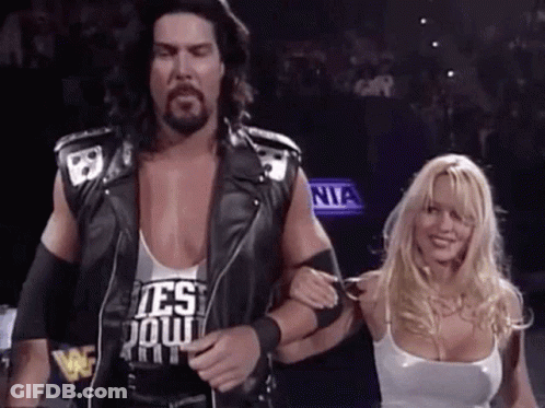 Man And Woman Standing On Stage GIF