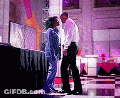 Man And Woman Standing On Stage GIF