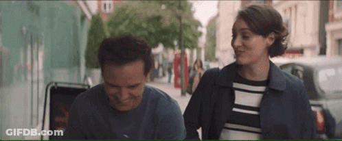 Man And Woman Standing On Street GIF