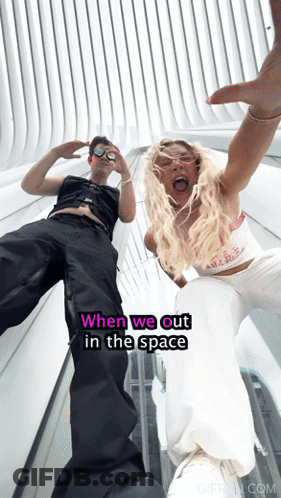 Man And Woman Standing Saying When We Out GIF