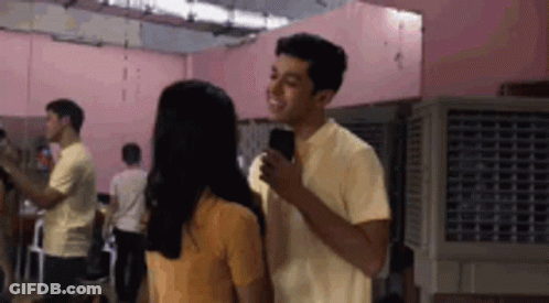 Man And Woman Standing Side By Side GIF
