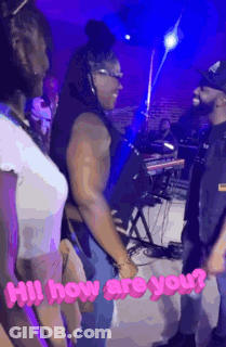Man And Woman Standing Together In Front Of Stage GIF