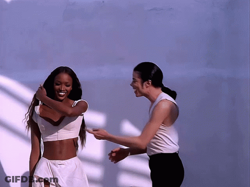 Man And Woman Standing Together Laughing GIF