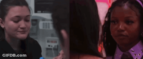 Man And Woman Standing Together Looking At Camera GIF